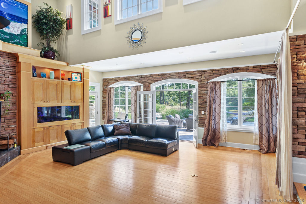 76 Sachem Head Road Guilford, CT 06437 - Photo 10 of 40 a living room with furniture and a large window