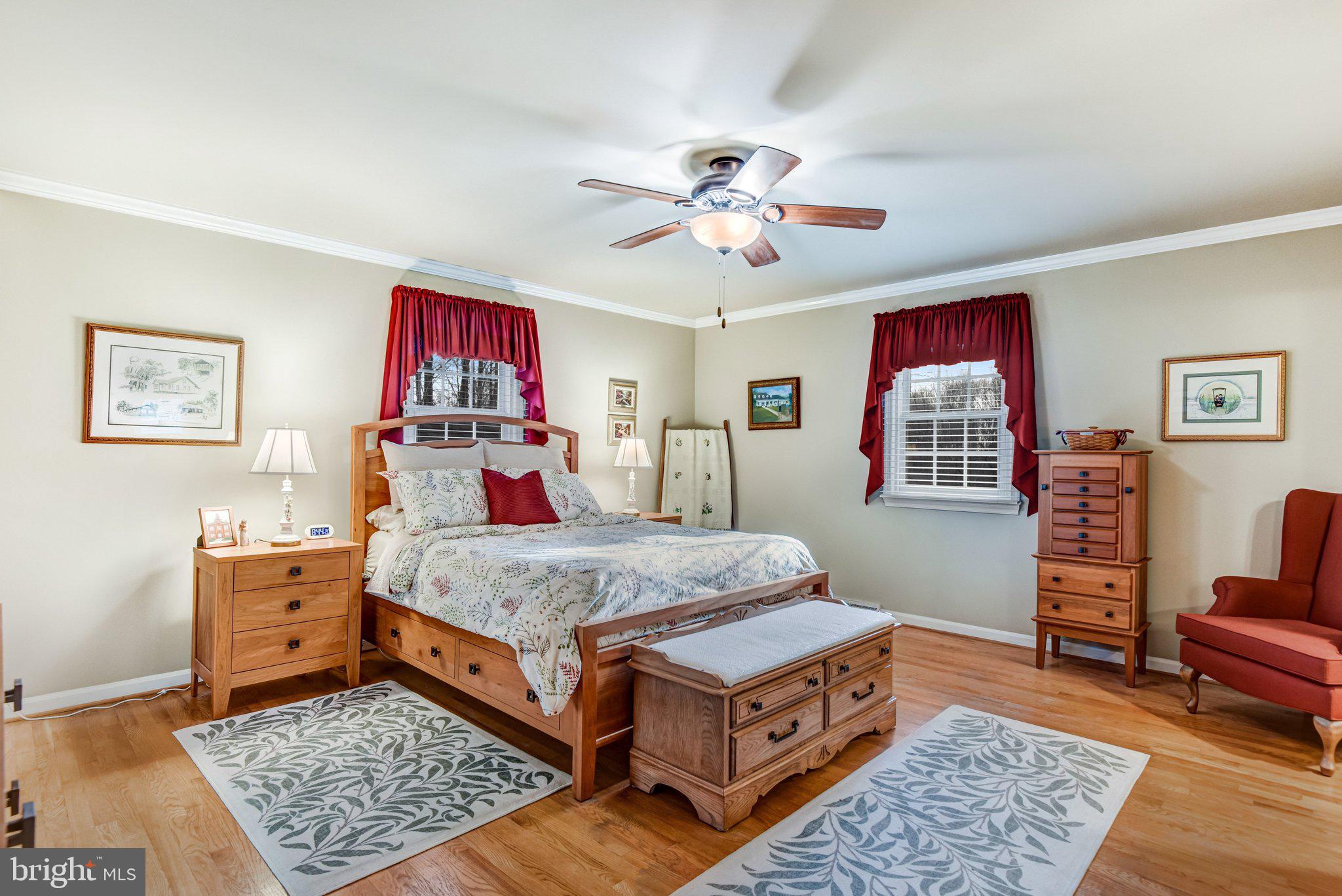10111 Evans Ford Road Manassas, VA 20111 - Photo 12 of 35 a bed room with a bed window and dresser