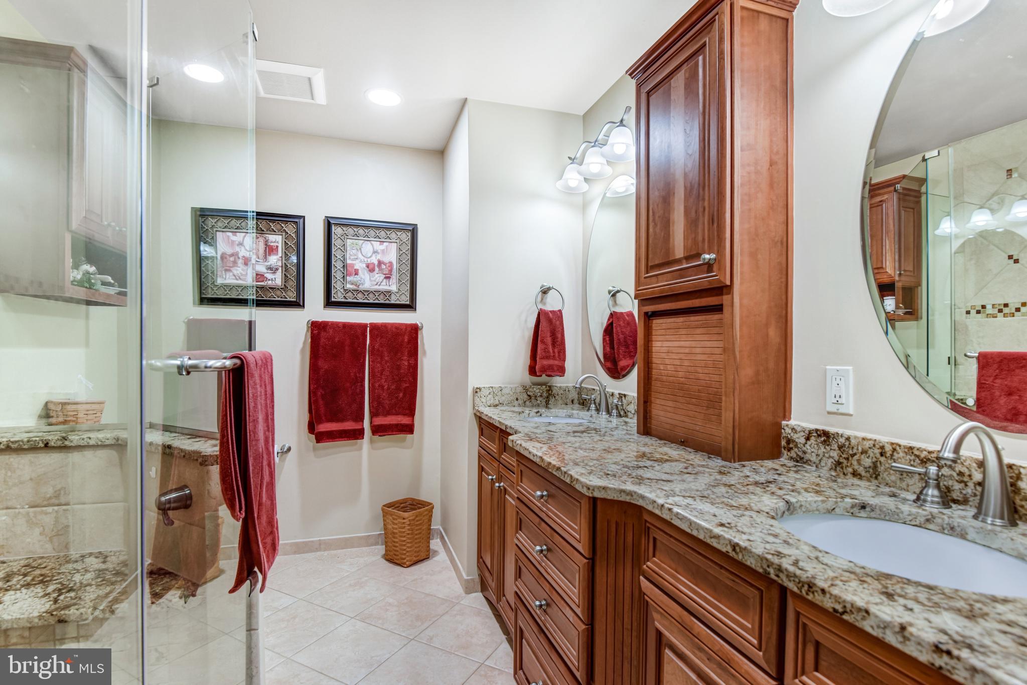 10111 Evans Ford Road Manassas, VA 20111 - Photo 14 of 35 a bathroom with a granite countertop double vanity sink and a mirror