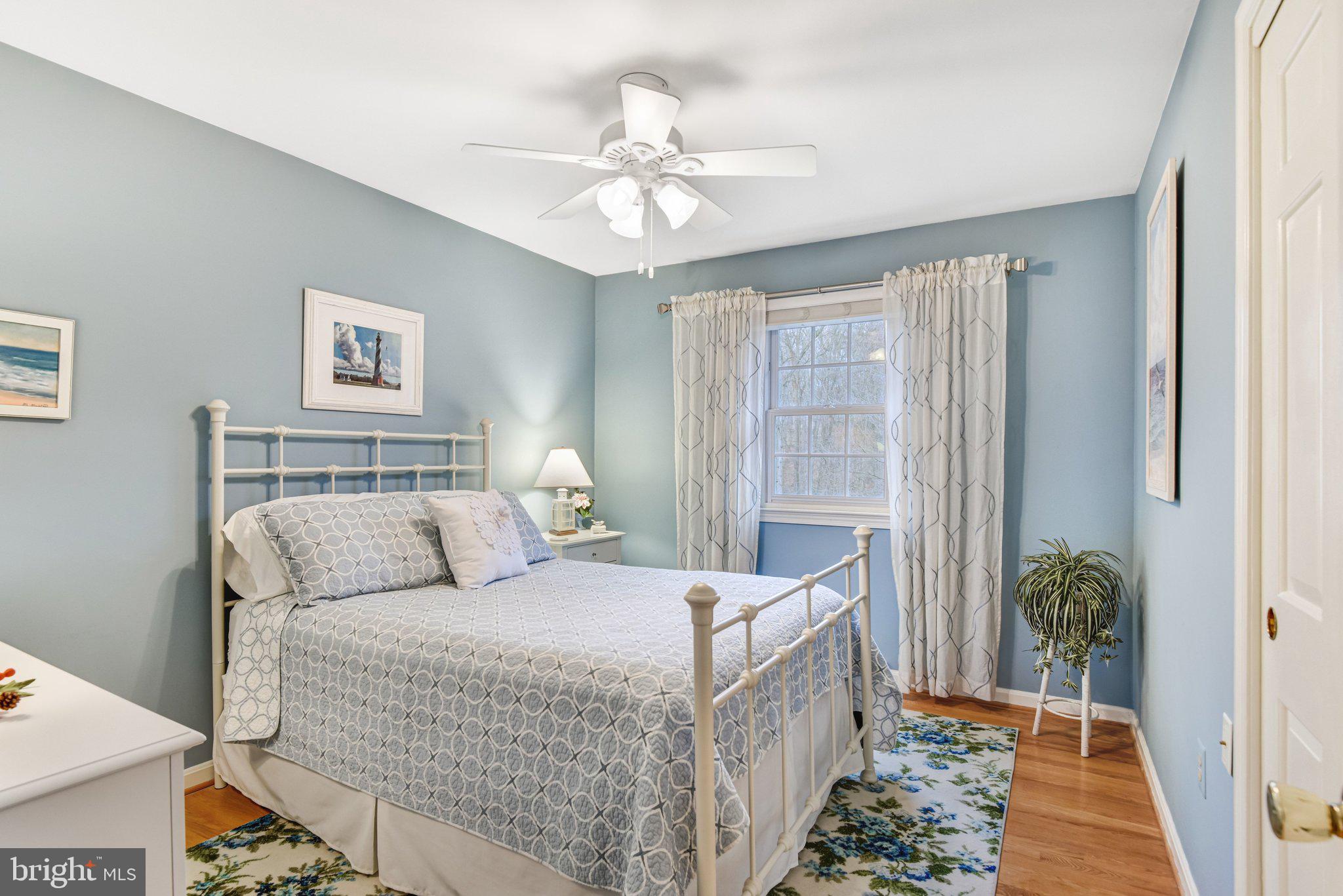 10111 Evans Ford Road Manassas, VA 20111 - Photo 15 of 35 a bedroom with a bed and a window