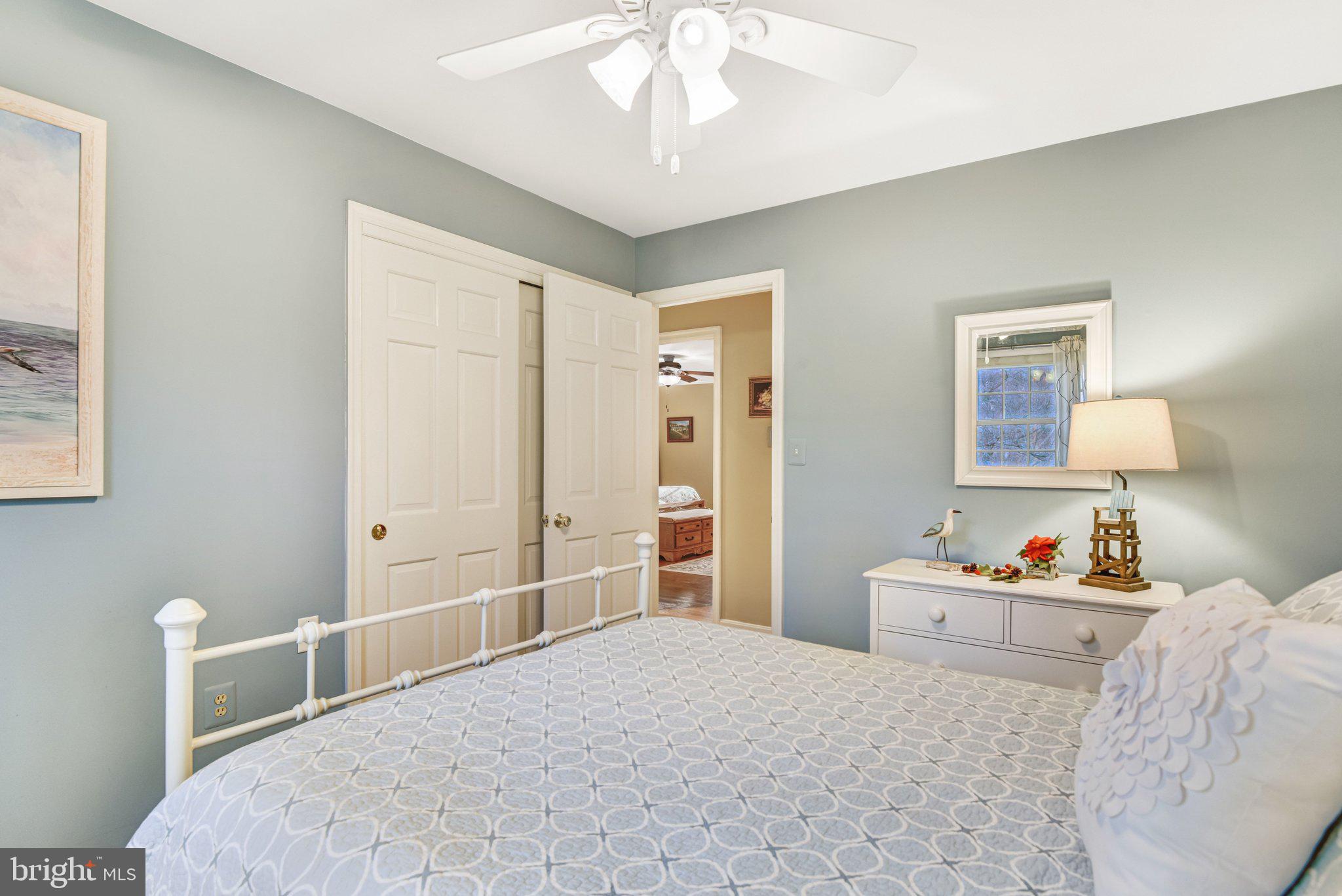 10111 Evans Ford Road Manassas, VA 20111 - Photo 16 of 35 a bedroom with a bed and a chandelier