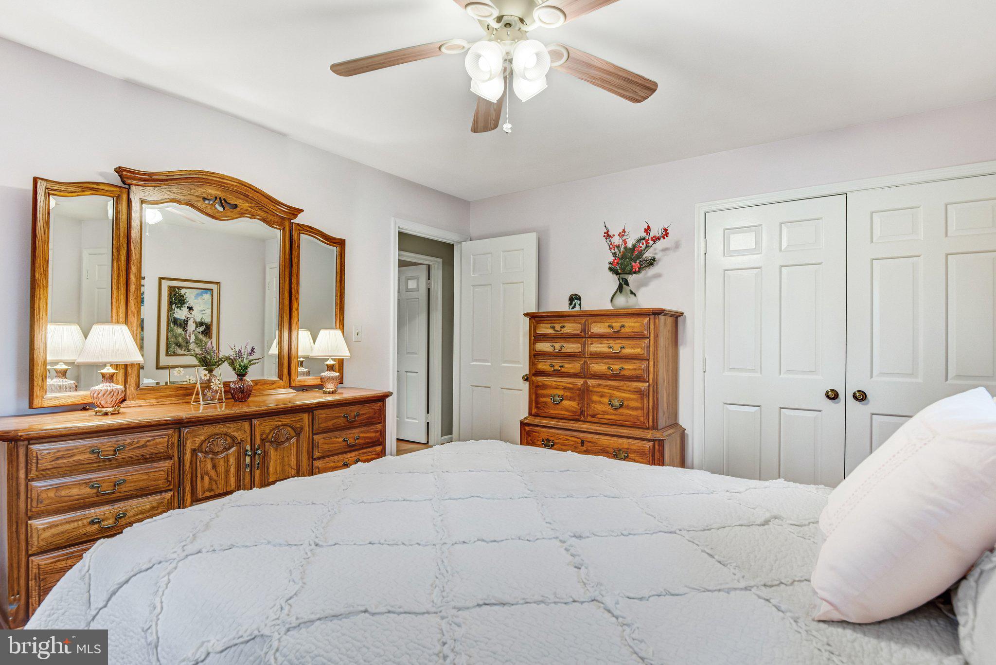 10111 Evans Ford Road Manassas, VA 20111 - Photo 19 of 35 a bedroom with a bed and a chandelier