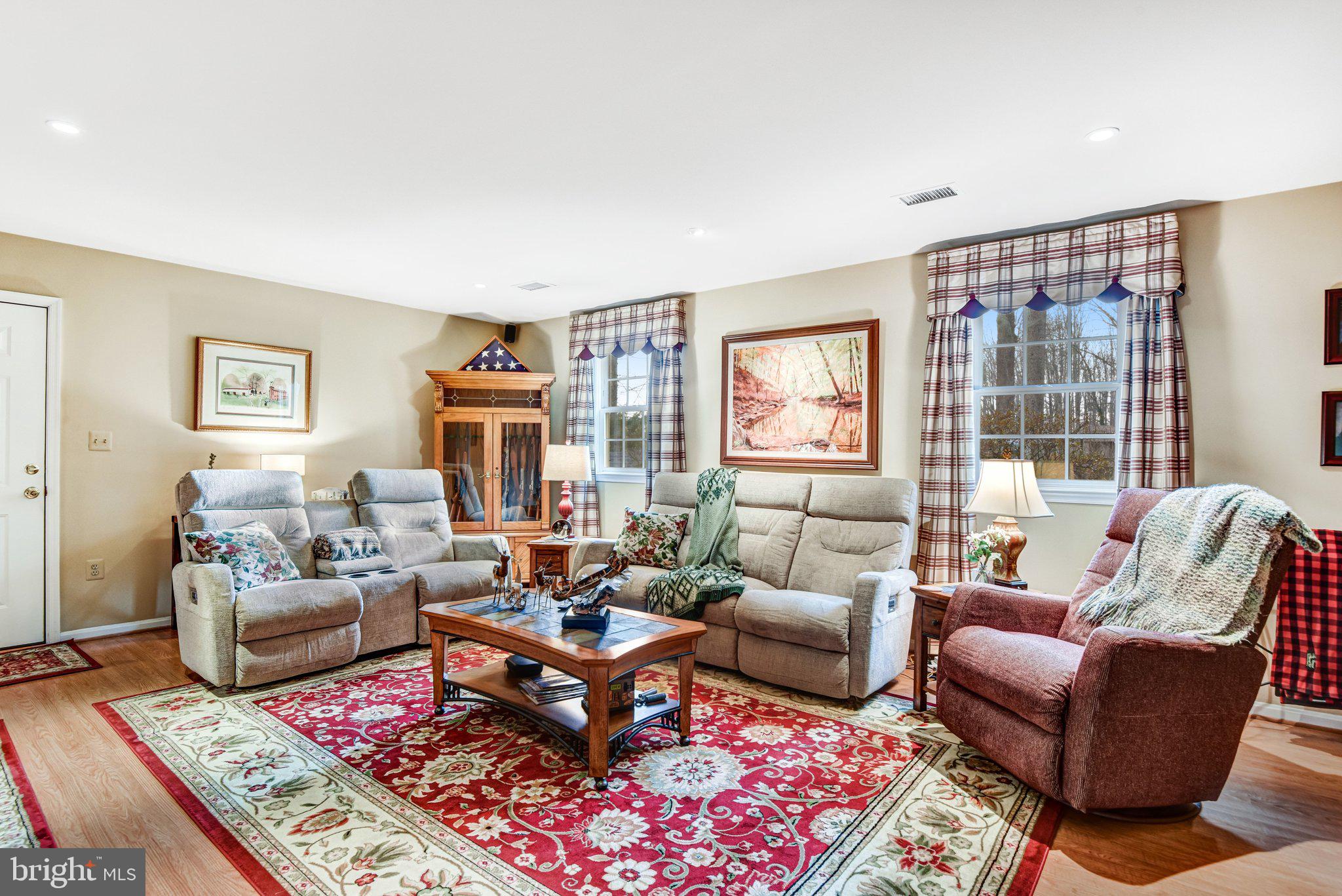 10111 Evans Ford Road Manassas, VA 20111 - Photo 20 of 35 a living room with furniture wooden floor and a large window