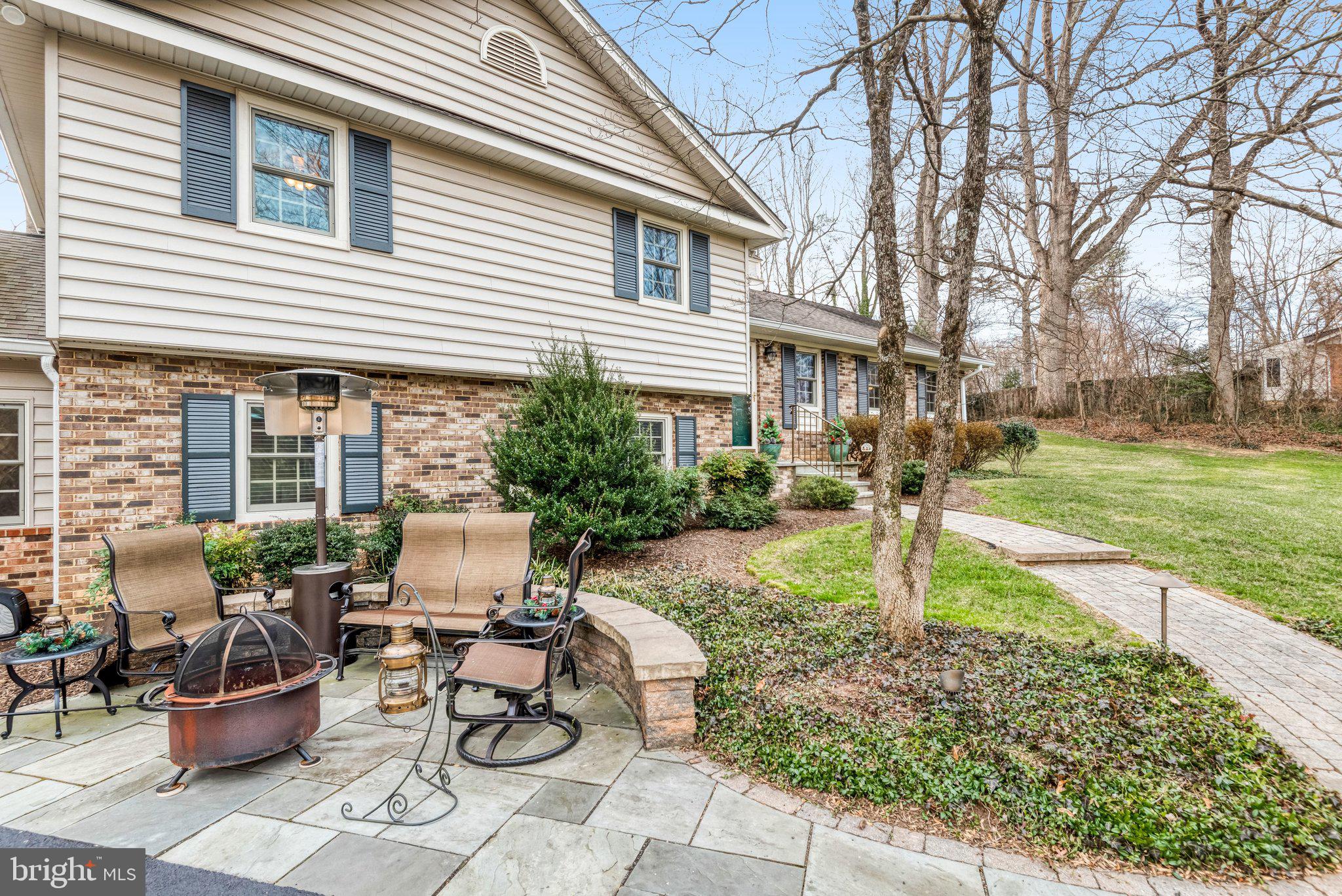 10111 Evans Ford Road Manassas, VA 20111 - Photo 2 of 35 a view of a patio with chair and tables back yard of the house
