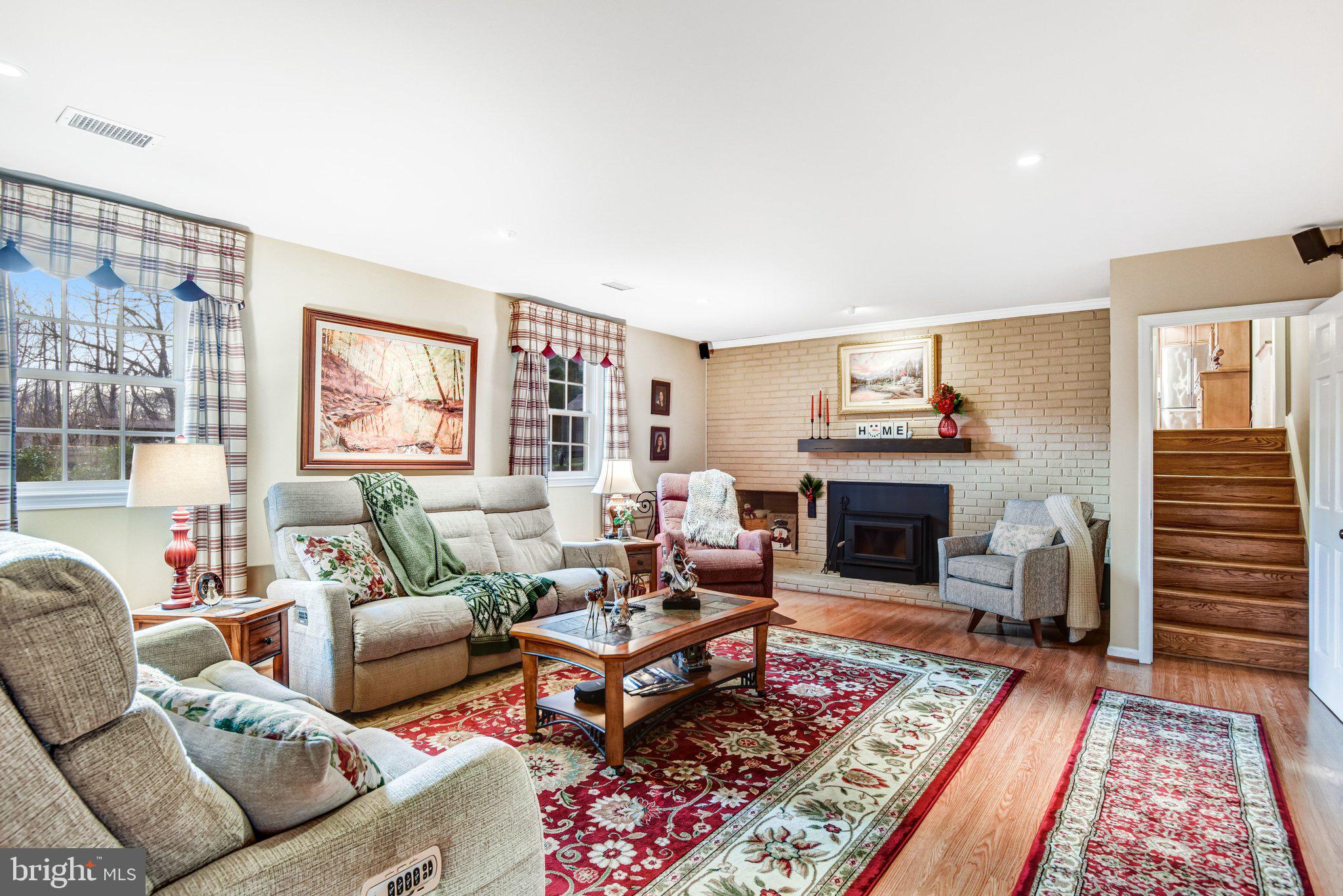 10111 Evans Ford Road Manassas, VA 20111 - Photo 21 of 35 a living room with furniture and a fireplace