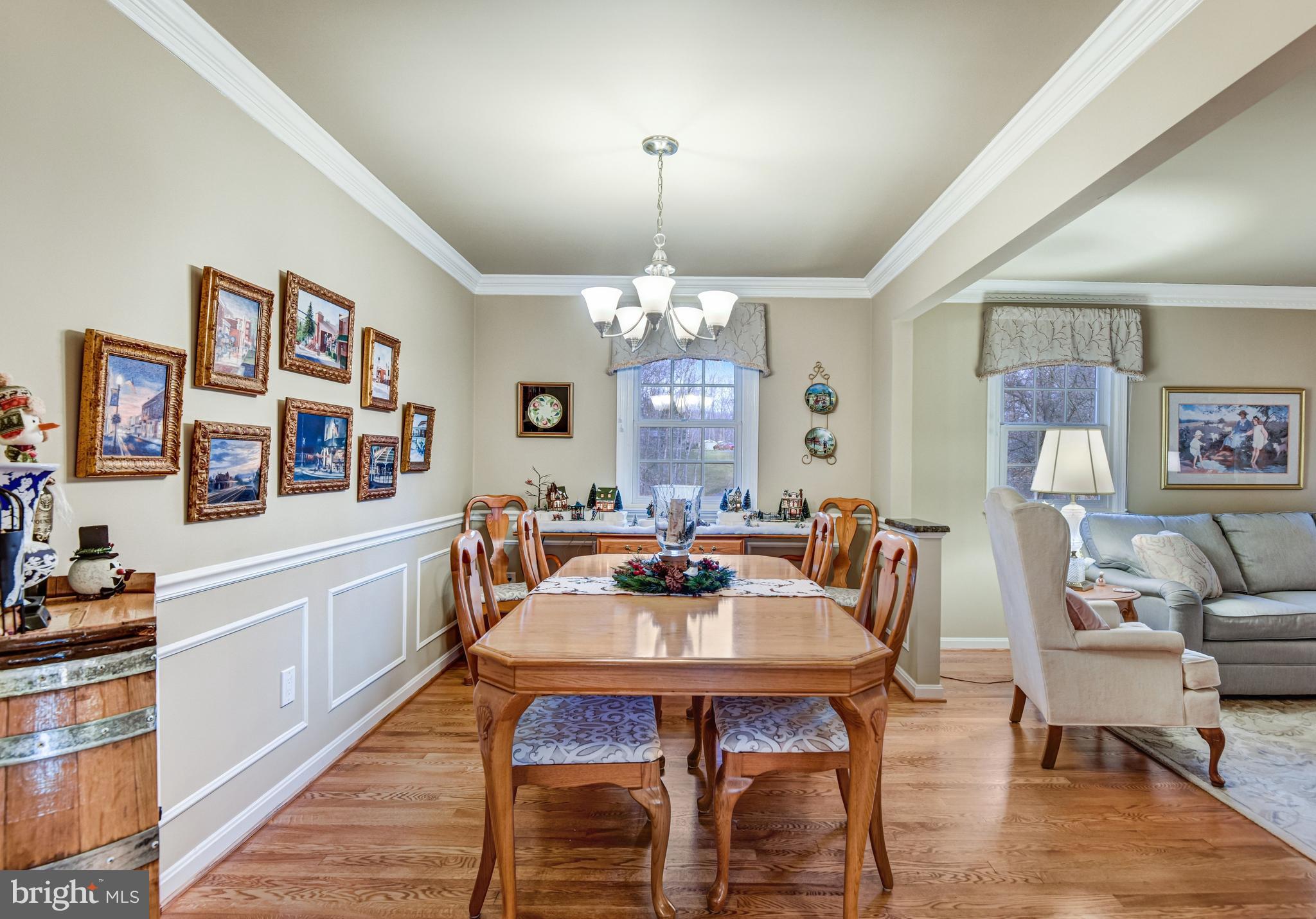 10111 Evans Ford Road Manassas, VA 20111 - Photo 5 of 35 a dining room with furniture a rug and wooden floor
