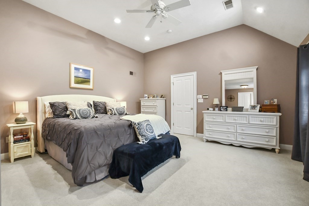 40 Oheir Way Lowell, MA 01852 - Photo 17 of 42 a spacious bedroom with a bed and ceiling fan