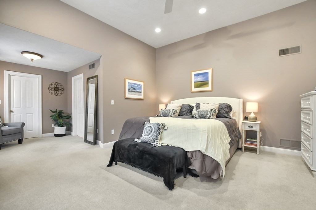 40 Oheir Way Lowell, MA 01852 - Photo 18 of 42 a bedroom with a bed and ceiling fan