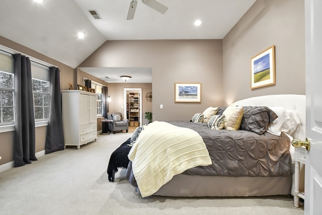 40 Oheir Way Lowell, MA 01852 - Photo 19 of 42 a spacious bedroom with a bed and glass wall