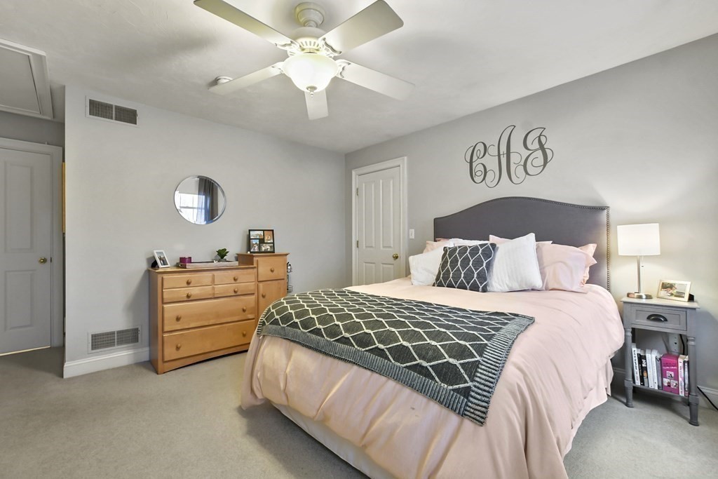 40 Oheir Way Lowell, MA 01852 - Photo 27 of 42 a bedroom with a bed and a chandelier