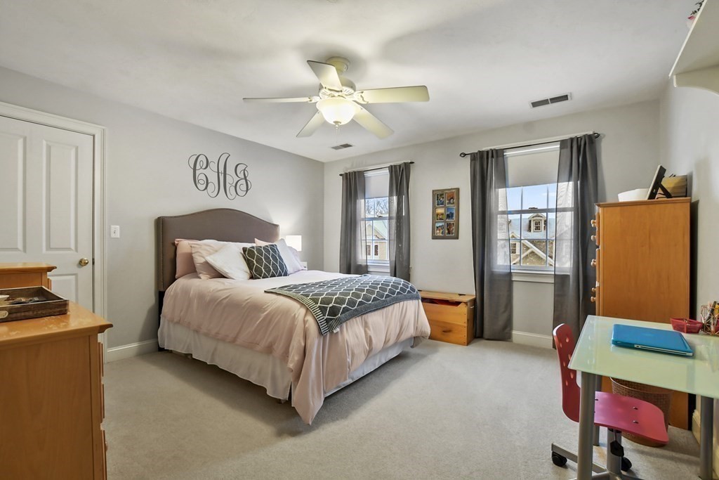 40 Oheir Way Lowell, MA 01852 - Photo 29 of 42 a bedroom with a bed a dresser and a window