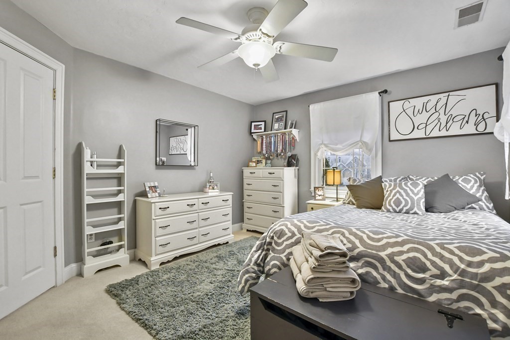 40 Oheir Way Lowell, MA 01852 - Photo 32 of 42 a bedroom with a bed and a walk in closet