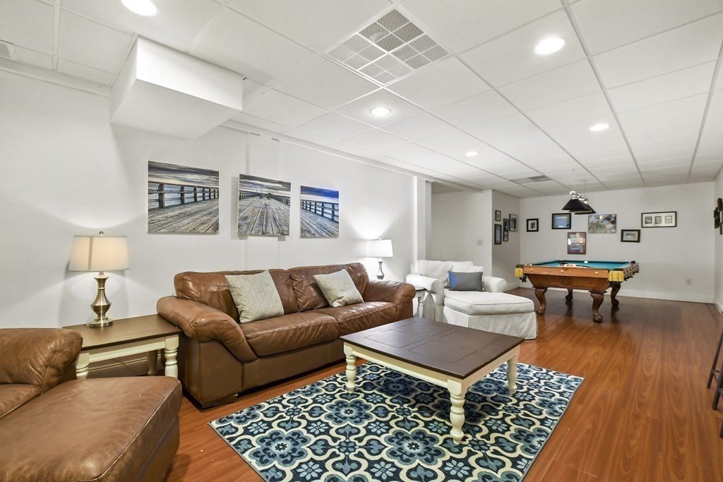 40 Oheir Way Lowell, MA 01852 - Photo 34 of 42 a living room with furniture a rug and a table