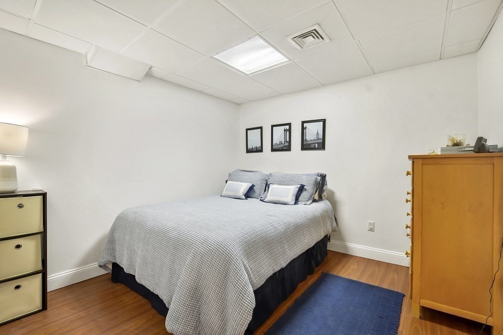 40 Oheir Way Lowell, MA 01852 - Photo 38 of 42 a bedroom with bed and wooden floor