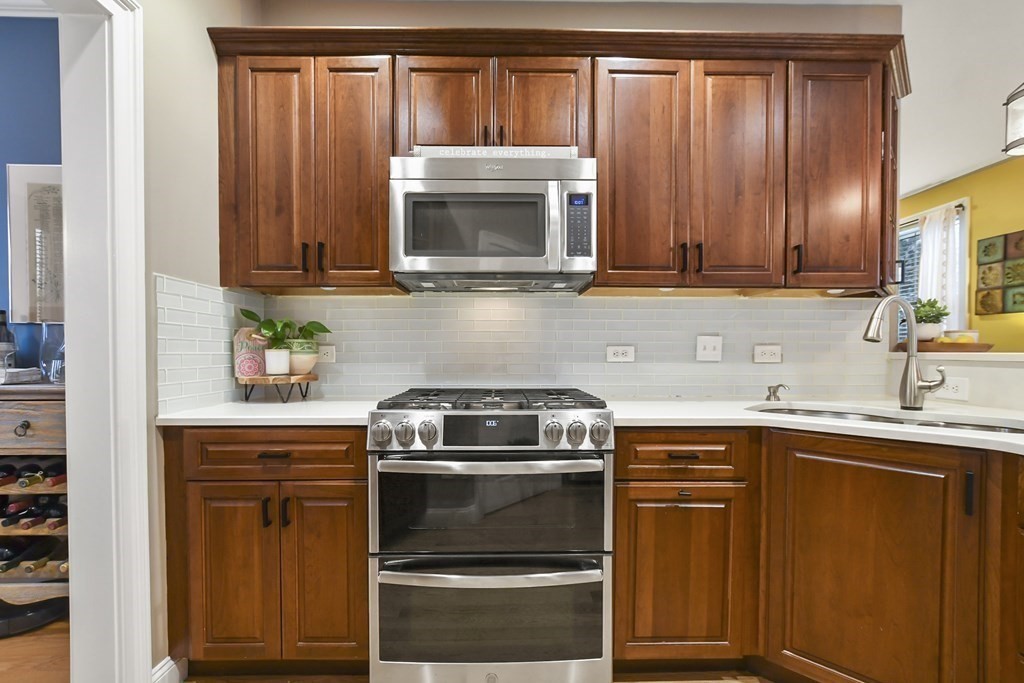 40 Oheir Way Lowell, MA 01852 - Photo 6 of 42 a kitchen with a sink stove and microwave