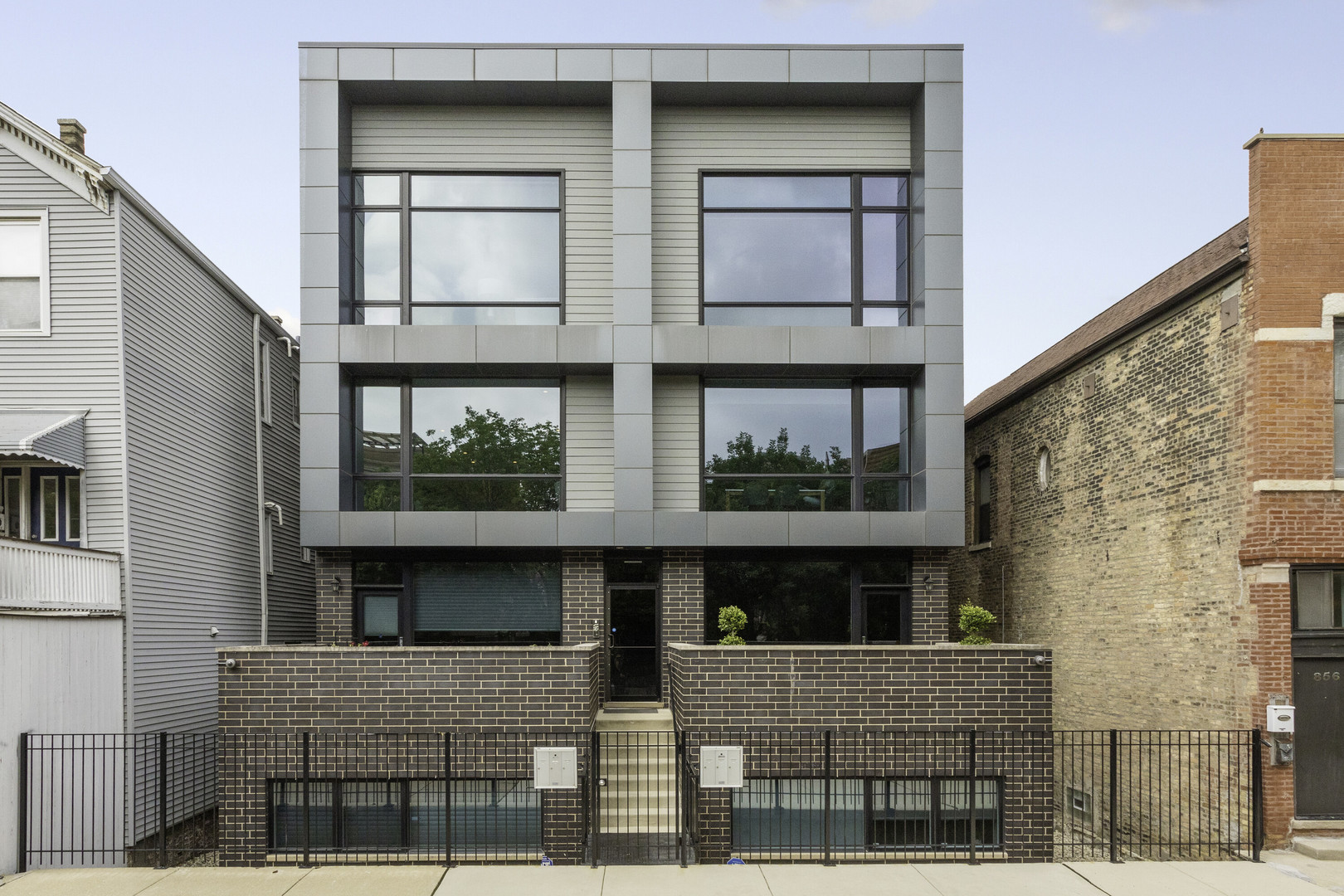 a front view of a building with glass windows