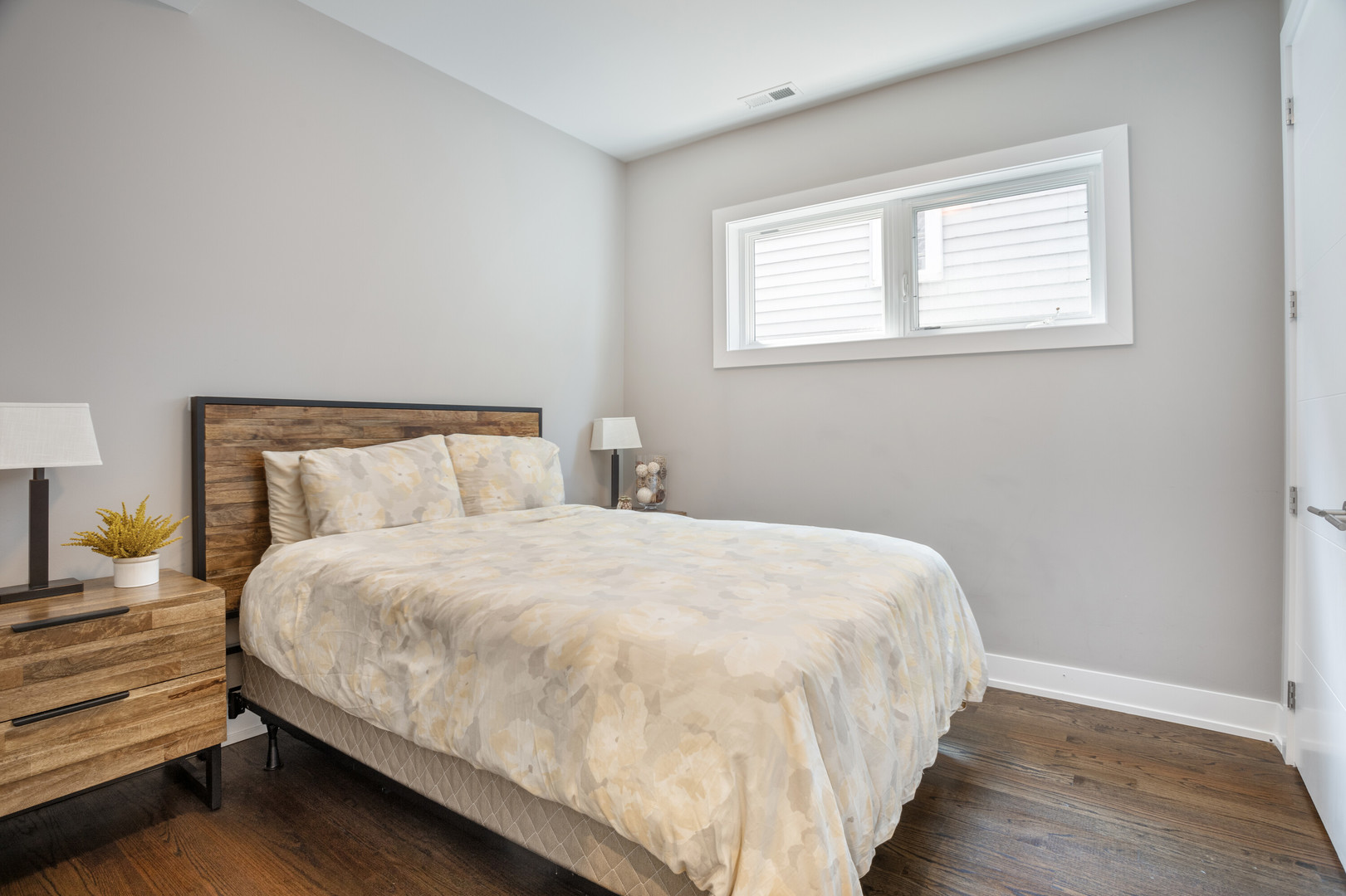 854 North May Street, Unit 2S Chicago, IL 60642 - Photo 11 of 16 a large bed sitting in a bedroom next to a window