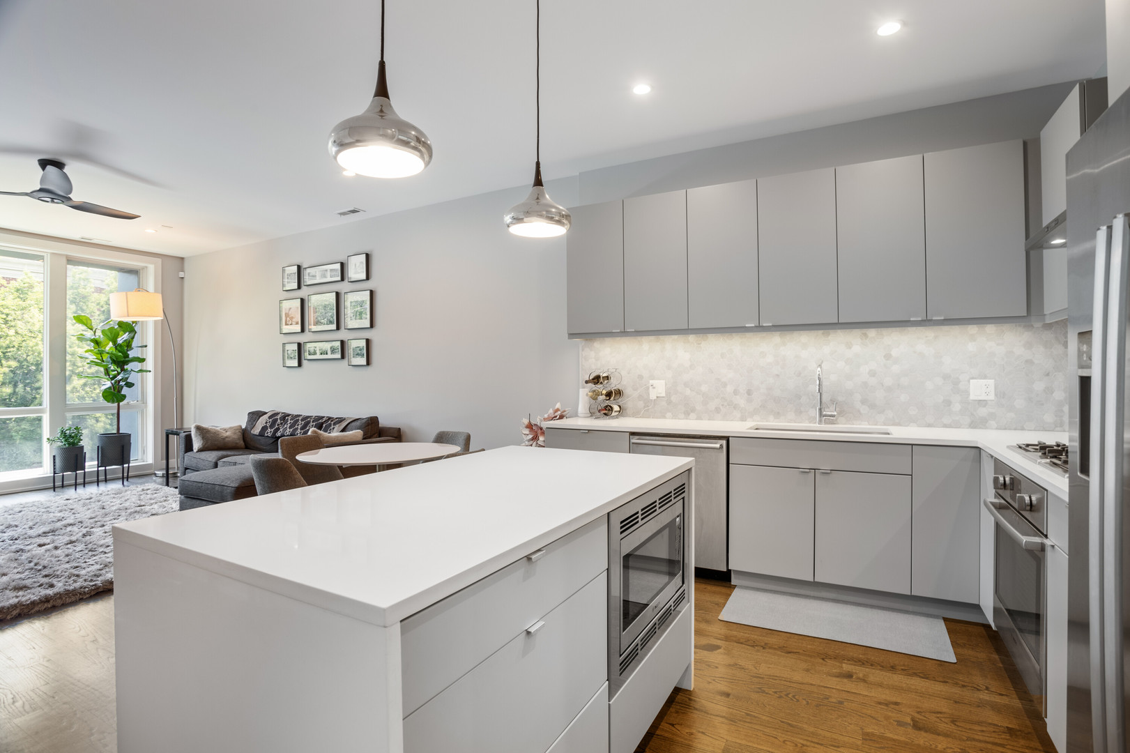 854 North May Street, Unit 2S Chicago, IL 60642 - Photo 6 of 16 a kitchen with a sink a stove a refrigerator and cabinets