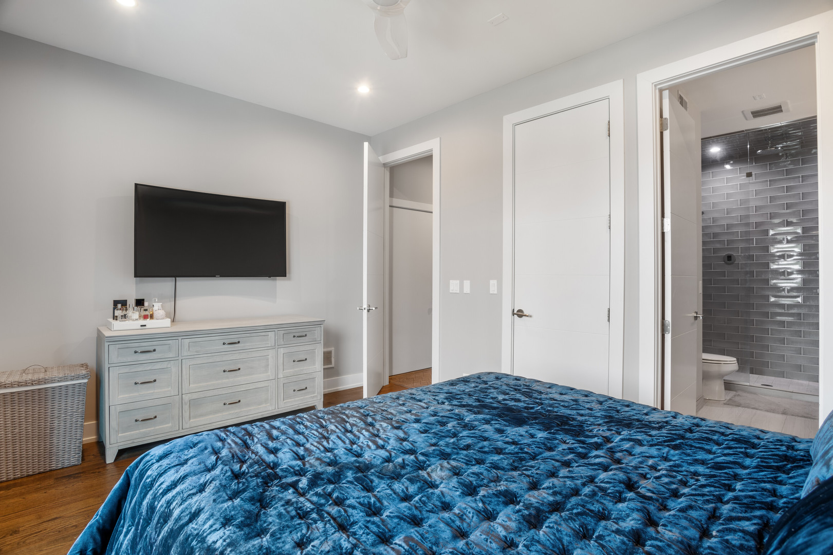 854 North May Street, Unit 2S Chicago, IL 60642 - Photo 9 of 16 a bedroom with a bed and a flat screen tv