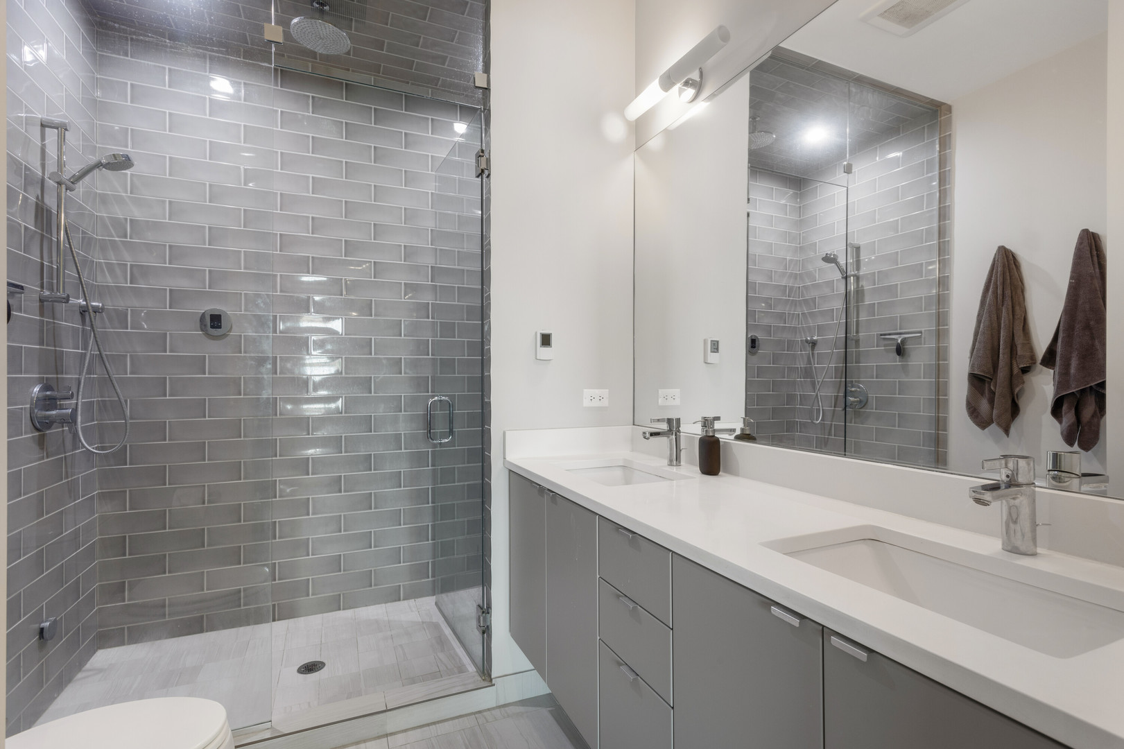 854 North May Street, Unit 2S Chicago, IL 60642 - Photo 10 of 16 a bathroom with a shower and a sink