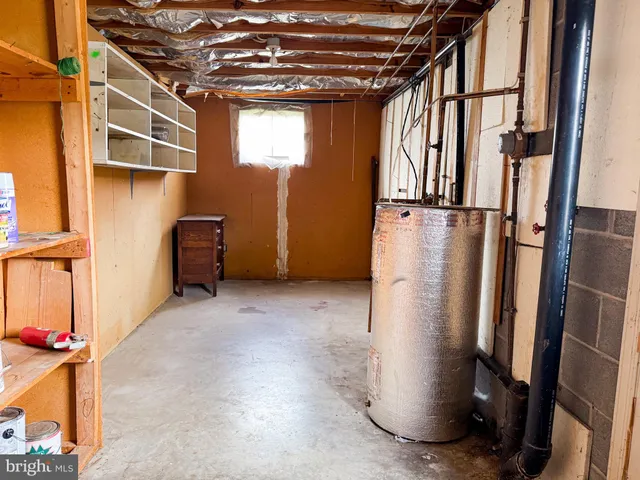 a view of a storage & utility room with stairs