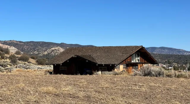 a view of a dry yard covered with snow