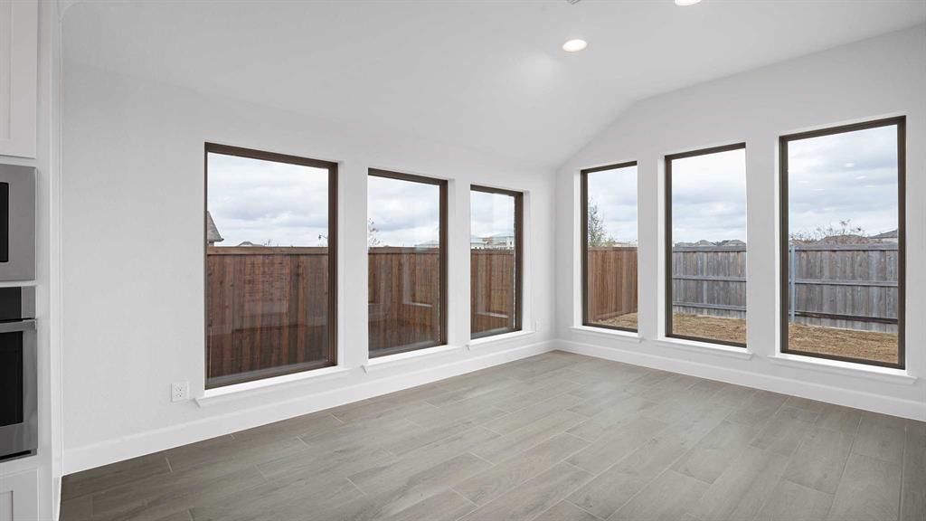 1104 Barnmeadow Lane Forney, TX 75126 - Photo 12 of 33 a view of an empty room with windows and balcony
