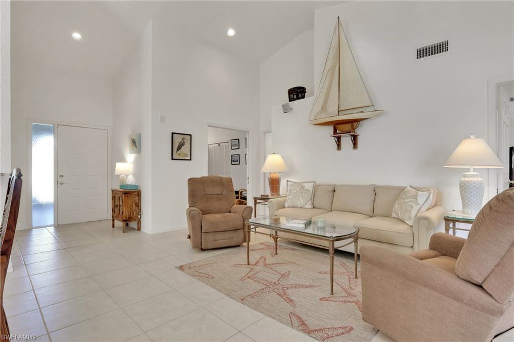 841 Kings Way Naples, FL 34104 - Photo 15 of 43 Tiled living area with a towering ceiling and recessed lighting