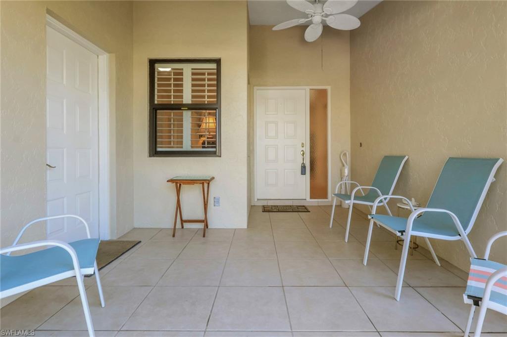 841 Kings Way Naples, FL 34104 - Photo 25 of 43 View of exterior entry with a ceiling fan