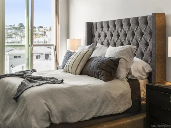a bedroom with a bed and window