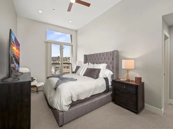 a bed room with a bed and a television