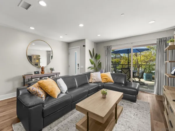 a living room with furniture and a large window