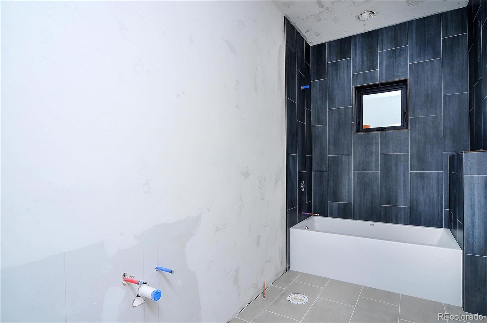 322 Two Rivers Road Salida, CO 81201 - Photo 12 of 18 a bathroom with a bathtub and shower