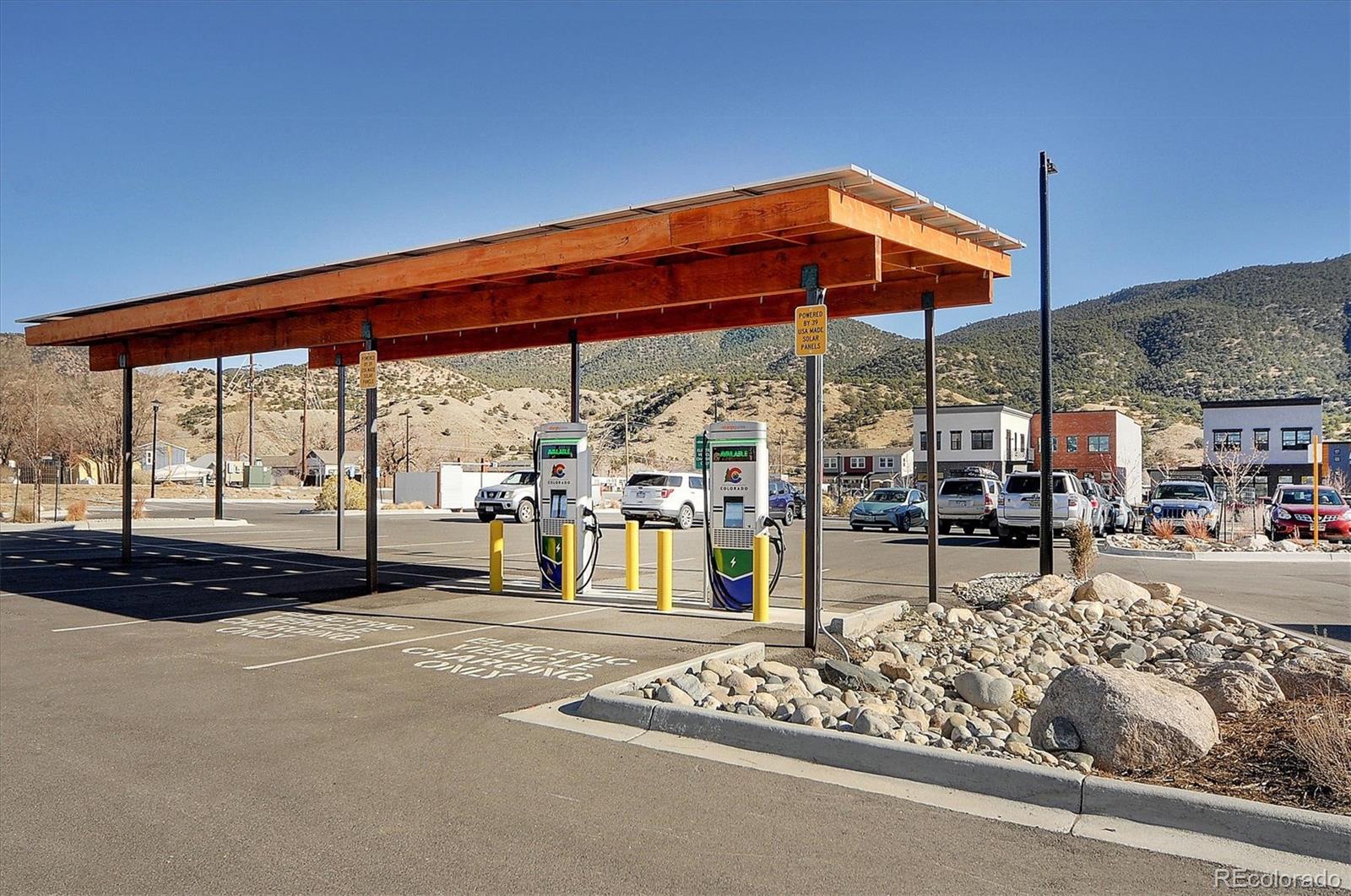 322 Two Rivers Road Salida, CO 81201 - Photo 18 of 18 a blue bench sitting in front of a building