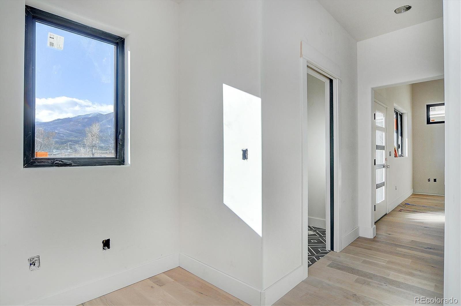322 Two Rivers Road Salida, CO 81201 - Photo 4 of 18 a view of a hallway with wooden floor