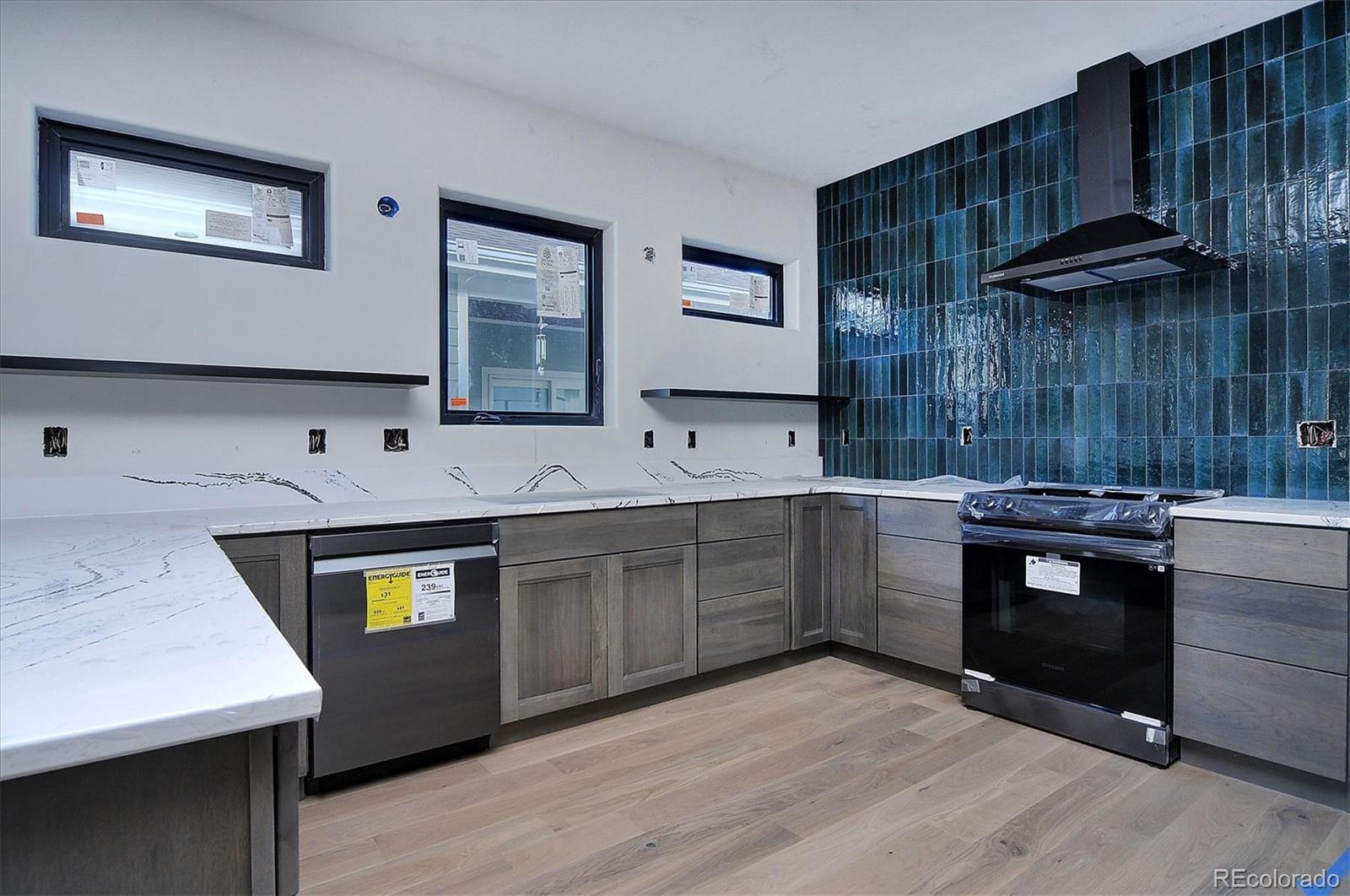 322 Two Rivers Road Salida, CO 81201 - Photo 5 of 18 a kitchen with a sink and a stove top oven