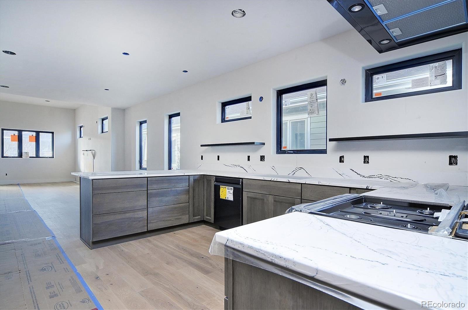 322 Two Rivers Road Salida, CO 81201 - Photo 6 of 18 a kitchen with a sink stove and cabinets