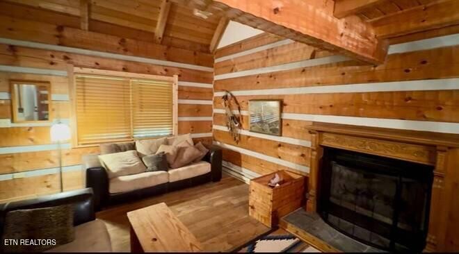 1428 Goodwater Road Bybee, TN 37713 - Photo 12 of 43 a living room with furniture and a fireplace