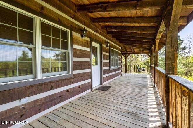 1428 Goodwater Road Bybee, TN 37713 - Photo 14 of 43 a view of a balcony with wooden floor