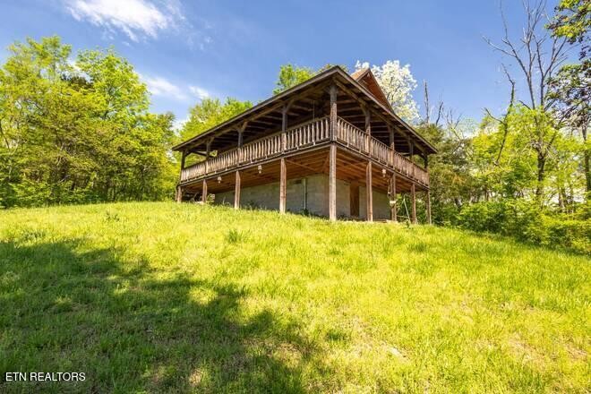 1428 Goodwater Road Bybee, TN 37713 - Photo 16 of 43 a view of a house with a yard