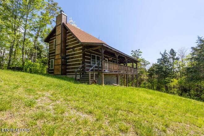 1428 Goodwater Road Bybee, TN 37713 - Photo 19 of 43 a view of house with backyard and garden