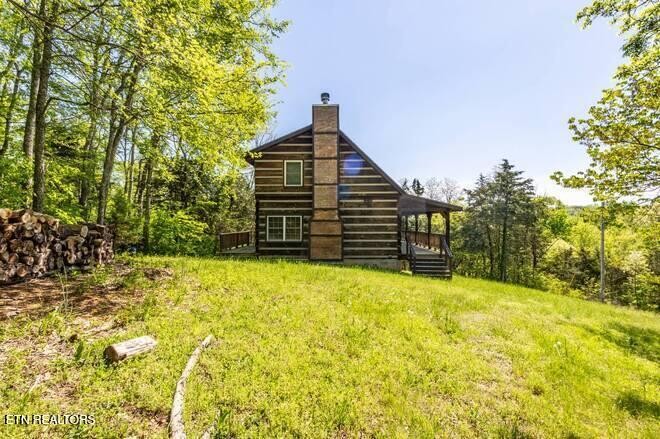 1428 Goodwater Road Bybee, TN 37713 - Photo 20 of 43 a view of a house with a yard