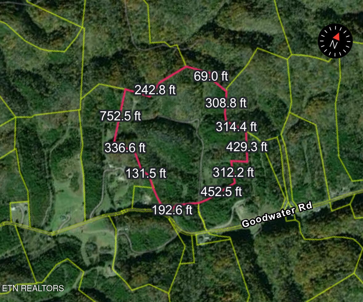 1428 Goodwater Road Bybee, TN 37713 - Photo 43 of 43 a sign that is sitting on a brick wall