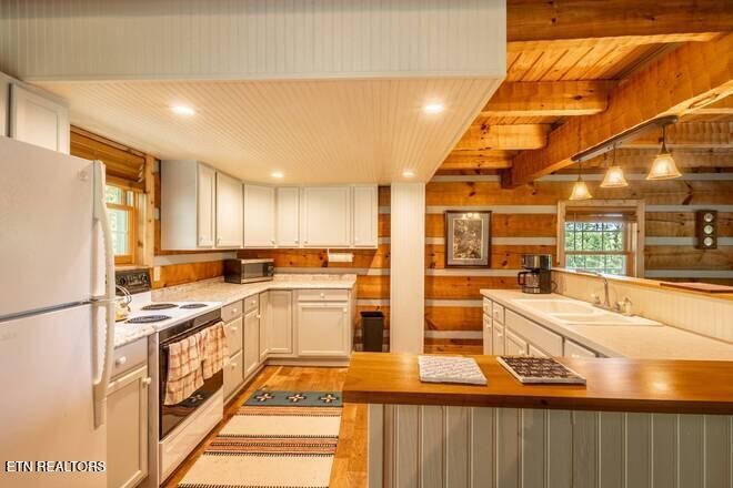 1428 Goodwater Road Bybee, TN 37713 - Photo 8 of 43 a kitchen with stainless steel appliances granite countertop a stove and a refrigerator