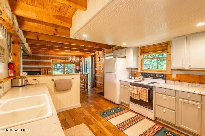 1428 Goodwater Road Bybee, TN 37713 - Photo 9 of 43 a open kitchen with stainless steel appliances granite countertop a stove a sink and a refrigerator