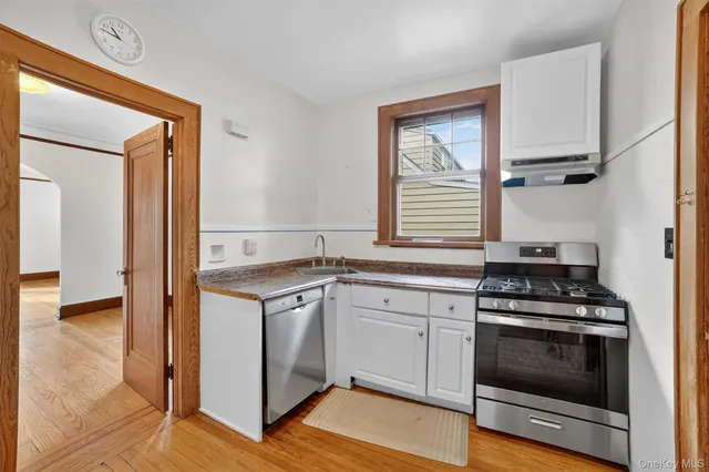 a kitchen with a stove and a microwave