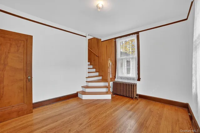 a view of entryway with wooden floor