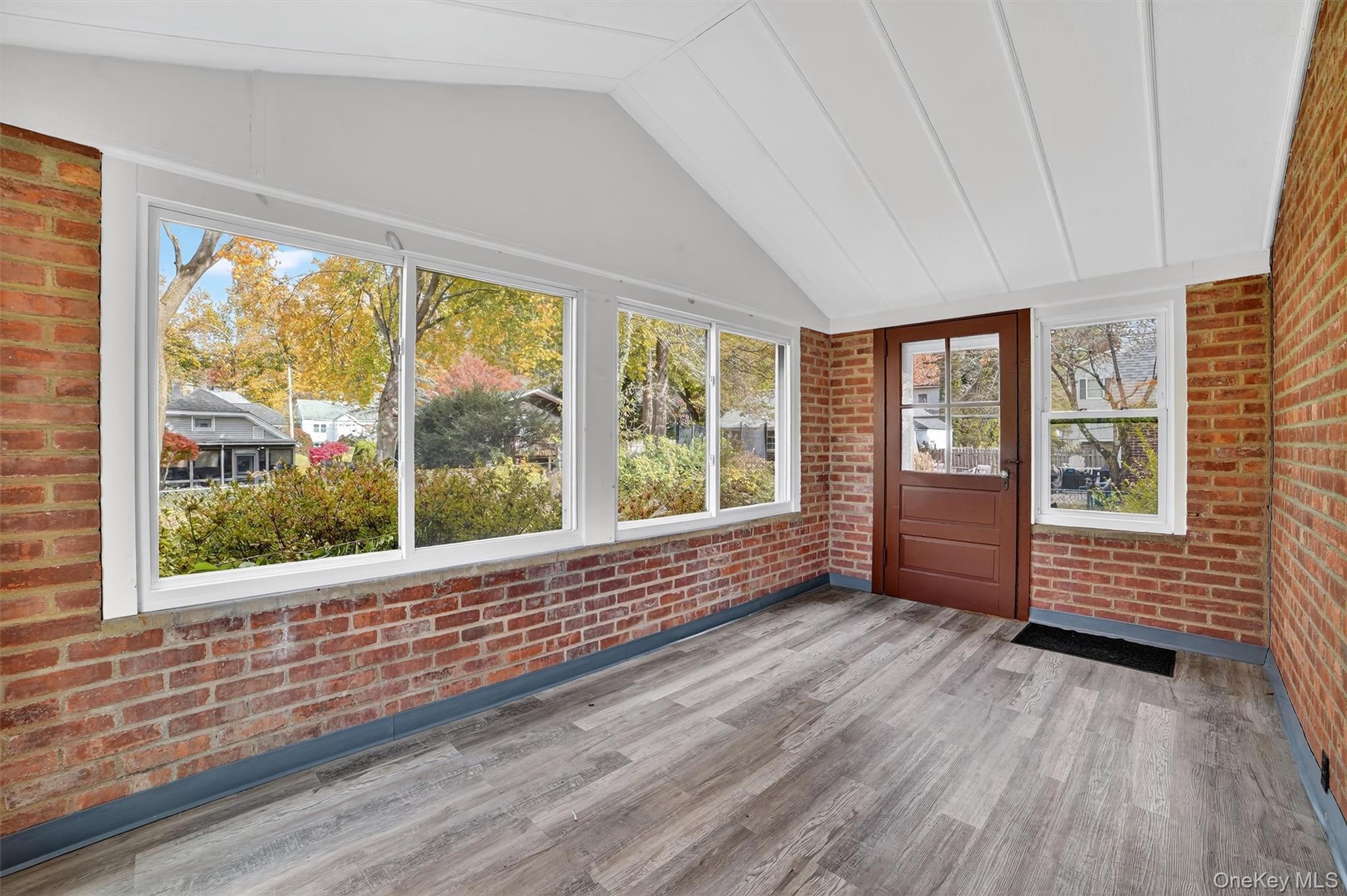 64 Elmore Avenue Croton-on-Hudson, NY 10520 - Photo 26 of 36 Unfurnished sunroom with lofted ceiling