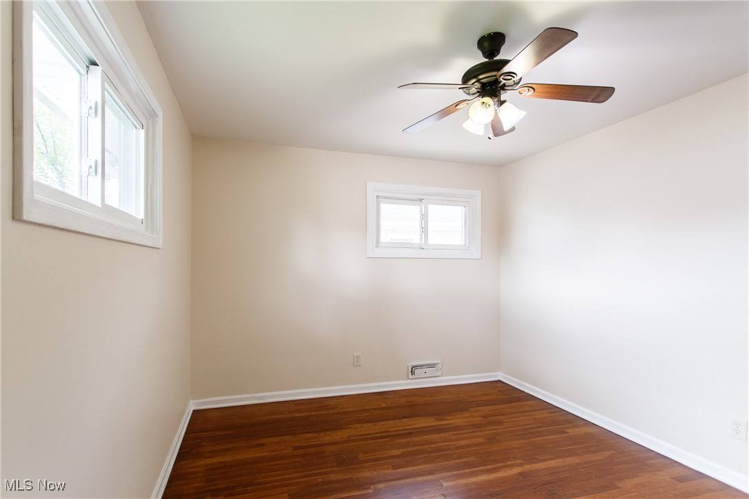 31827 Glenhurst Road Willowick, OH 44095 - Photo 29 of 44 Unfurnished room with wood finished floors, baseboards, and ceiling fan