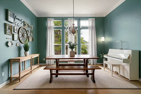a room with furniture and a potted plant